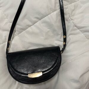 Small body cross bag in shade black from mango